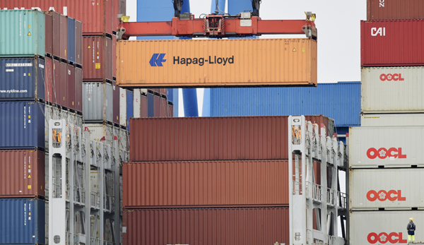 A Hapag Lloyd container is loaded on a ship at the shipping terminal Altenwerder in the harbour of Hamburg, Germany, on Monday (Reuters  photo)